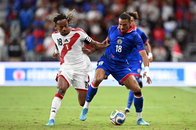 Haiti's forward #18 Wilson Isidor (R) and Peru's forward #18 Andre Carrillo fight for the ball during the international friendly football match between Haiti and Peru at Nu Stadium in Miami, Florida on June 5, 2026. (Photo by CHANDAN KHANNA / AFP)