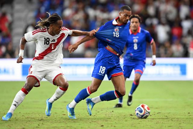 Haiti's forward #18 Wilson Isidor (R) and Peru's forward #18 Andre Carrillo fight for the ball during the international friendly football match between Haiti and Peru at Nu Stadium in Miami, Florida on June 5, 2026. (Photo by CHANDAN KHANNA / AFP)