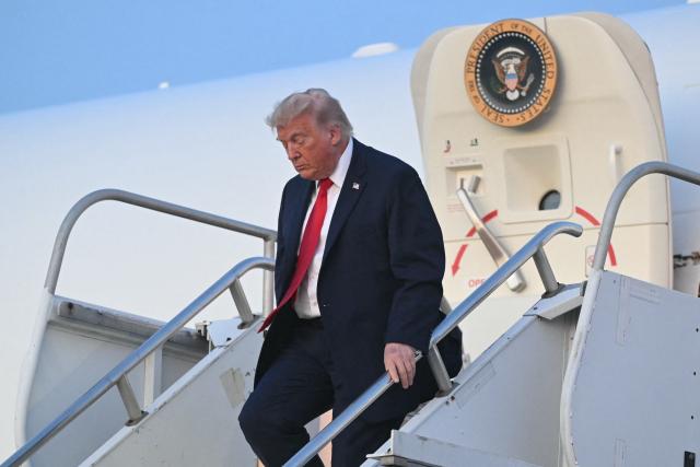 US President Donald Trump disembarks Air Force One upon arrival at Morristown Airport in Morris County, New Jersey, on June 5, 2026. US President Donald Trump will spend the weekend in Bedminster, New Jersey. (Photo by SAUL LOEB / AFP)