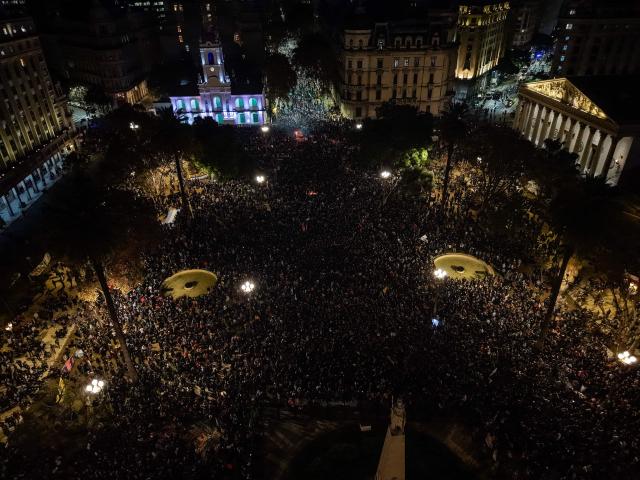 Aerial view of fans of Carlos Alberto "Indio" Solari, the iconic Argentine rock musician and former lead singer of Patricio Rey y sus Redonditos de Ricota, gathering at Plaza de Mayo after the singer died in Parque Leloir, Buenos Aires Province, at the age of 77, on June 5, 2026. (Photo by Tomas CUESTA / AFP)