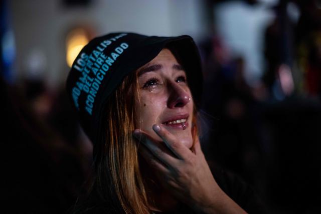 A fan of Carlos Alberto "Indio" Solari, the iconic Argentine rock musician and former lead singer of Patricio Rey y sus Redonditos de Ricota, cries during a gathering at Plaza de Mayo after the singer died in Parque Leloir, Buenos Aires Province, at the age of 77, on June 5, 2026. (Photo by Tomas CUESTA / AFP)