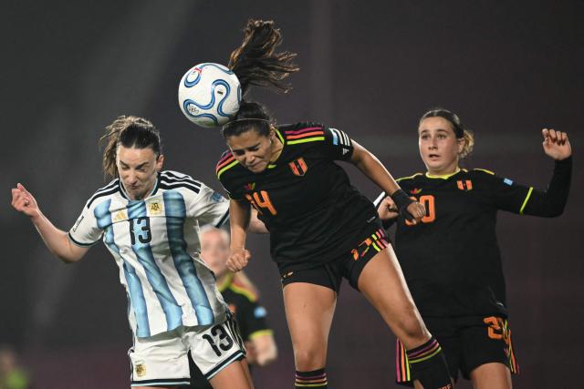 Argentina's defender #13 Sophia Braun and Peru's midfielder #14 Mia Leon jump for the ball during the CONMEBOL Nations League Women football match between Argentina and Peru at the Florencio Sola stadium in Buenos Aires on June 5, 2026. (Photo by Luis ROBAYO / AFP)