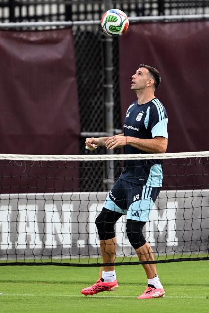 Argentina's goalkeeper Emiliano "Dibu" Martinez controls a ball during a training session at Kyle Field in College Station, Texas, on June 5, 2026. Argentina will face Honduras in a friendly match on June 6, 2026. (Photo by RONALDO SCHEMIDT / AFP)