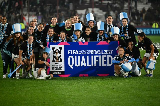 Argentina's team members celebrate qualification for the 2027 FIFA Women's World Cup at the end of the CONMEBOL Nations League women's football match between Argentina and Peru at the Florencio Sola stadium in Buenos Aires on June 5, 2026. (Photo by Luis ROBAYO / AFP)