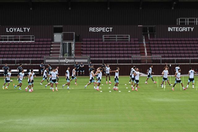 The words Loyalty, Respect and Integrity are seen on the stadium walls as Argentina's players participate in a training session at Kyle Field in College Station, Texas, on June 5, 2026, the day before a friendly match against Honduras. Argentina will face Honduras in a friendly match on June 6, 2026. (Photo by RONALDO SCHEMIDT / AFP)