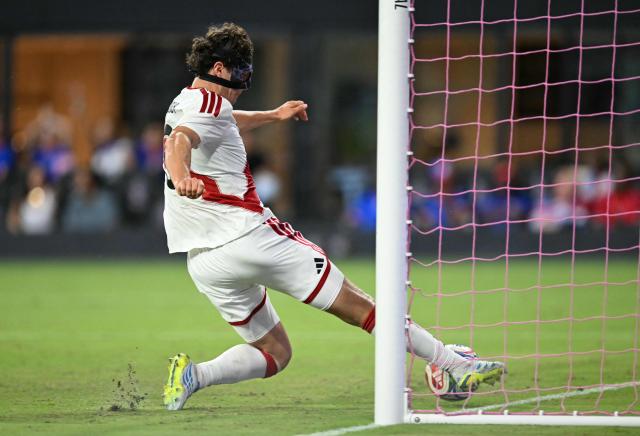 Peru's defender #03 Fabio Gruber slides to save a goal during the international friendly football match between Haiti and Peru at Nu Stadium in Miami, Florida on June 5, 2026. (Photo by CHANDAN KHANNA / AFP)