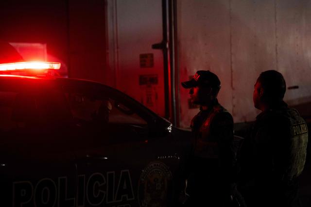 Police officers custody trucks loaded with election material at Peru's National Office of Electoral Processes (ONPE) in Lima on June 5, 2026. Right-wing candidate Keiko Fujimori and leftist Roberto Sanchez will face off in Peru's presidential runoff on June 7, 2026. (Photo by ERNESTO BENAVIDES / AFP)