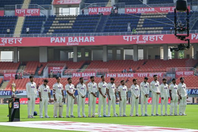 Indian players stand for their national anthem before the start of the first day of the only Test cricket match between India and Afghanistan at the Maharaja Yadavindra Singh International Cricket Stadium on the outskirts of Chandigarh on June 6, 2026. (Photo by Shammi MEHRA / AFP)