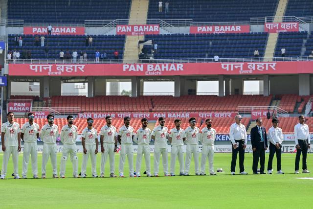 Afghanistan's players stand for their national anthem before the start of the first day of the only Test cricket match between India and Afghanistan at the Maharaja Yadavindra Singh International Cricket Stadium on the outskirts of Chandigarh on June 6, 2026. (Photo by Shammi MEHRA / AFP)