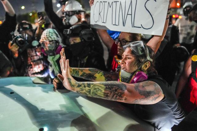Protesters try to block a vehicle from leaving Delaney Hall, which is being used as an Immigration and Customs Enforcement (ICE) detention center, in Newark, New Jersey, on June 5, 2026. The US state of New Jersey on June 2, 2026, sued the private prison company that runs a migrant detention center where protesters have rallied for several days over allegedly poor conditions at the jail. The lawsuit against GEO Group demands that local health authorities be allowed full access to Delaney Hall, one of many facilities holding people rounded up in US President Donald Trump's mass deportation sweep. (Photo by Ryan MURPHY / AFP)