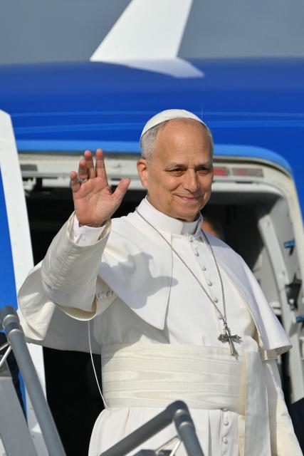 Pope Leo XIV salutes as he prepares to board his plane heading to Madrid at Rome's Fiumicino airport, on June 6, 2026. Pope Leo XIV is visiting Spain June 6-12 with stops in Madrid, Barcelona, and the Canary Islands, where he will meet with migrants and organisations dedicated to helping them. (Photo by Alberto PIZZOLI / AFP)