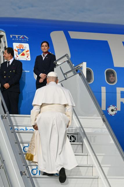 Pope Leo XIV boards his plane heading to Madrid at Rome's Fiumicino airport, on June 6, 2026. Pope Leo XIV is visiting Spain June 6-12 with stops in Madrid, Barcelona, and the Canary Islands, where he will meet with migrants and organisations dedicated to helping them. (Photo by Alberto PIZZOLI / AFP)