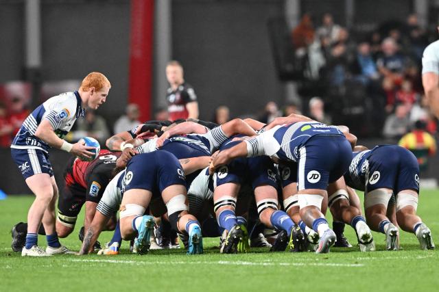 Blues' Finlay Christie (L) feeds the scrum during the Super Rugby Pacific Quarter final match between the Canterbury Crusaders and Blues at One New Zealand Stadium in Christchurch on June 6, 2026. (Photo by Sanka VIDANAGAMA / AFP)