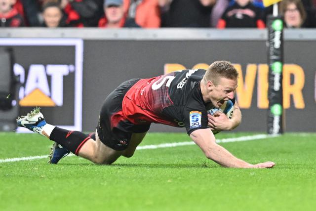 Crusaders' Johnny McNicholl scores a try during the Super Rugby Pacific Quarter final match between the Canterbury Crusaders and Blues at One New Zealand Stadium in Christchurch on June 6, 2026. (Photo by Sanka VIDANAGAMA / AFP)