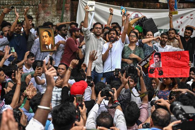 Cockroach Janta Party (CJP) founder Abhijeet Dipke (C, right) shouts slogans during a protest over alleged irregularities in the country's major examinations, in New Delhi on June 6, 2026. (Photo by Arun SANKAR / AFP)