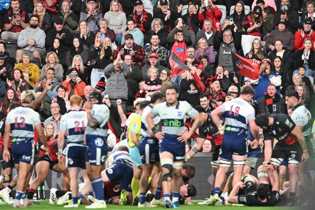 Fans cheer after the Crusaders' scored a try during the Super Rugby Pacific Quarter final match between the Canterbury Crusaders and Blues at One New Zealand Stadium in Christchurch on June 6, 2026. (Photo by Sanka VIDANAGAMA / AFP)