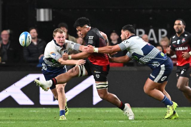 Crusaders' Christian Lio-Willie (C) kicks the ball during the Super Rugby Pacific quarter final match between the Canterbury Crusaders and Blues at One New Zealand Stadium in Christchurch on June 6, 2026. (Photo by Sanka VIDANAGAMA / AFP)