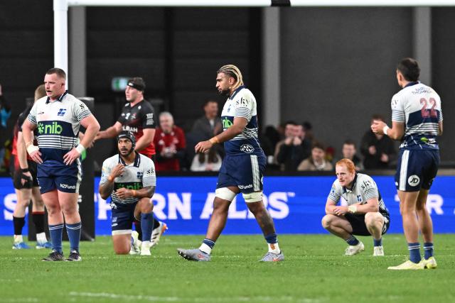 Blues' players react after the Crusaders' winning the Super Rugby Pacific quarter final match between the Canterbury Crusaders and Blues at One New Zealand Stadium in Christchurch on June 6, 2026. (Photo by Sanka VIDANAGAMA / AFP)