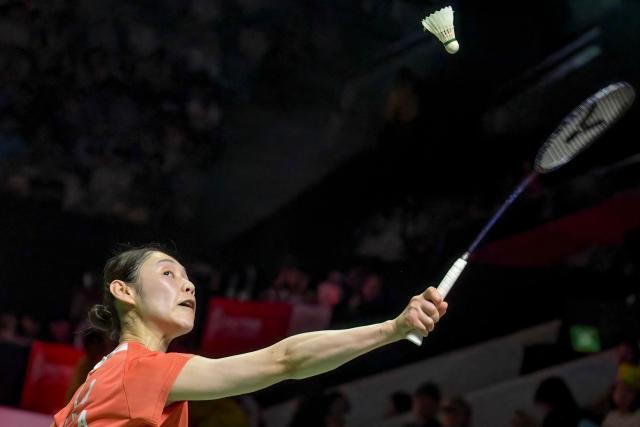 South Korea’s Sim Yu-jin hits a return against Japan’s Akane Yamaguchi during their women's singles semi-final match at the Indonesia Open badminton tournament in Jakarta on June 6, 2026. (Photo by BAY ISMOYO / AFP)