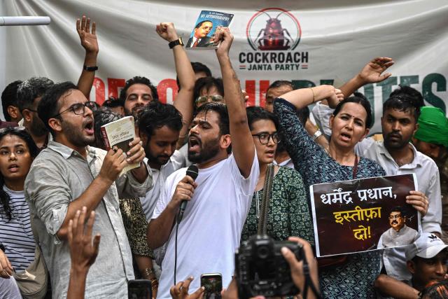 Cockroach Janta Party (CJP) founder Abhijeet Dipke (C) shouts slogans during a protest over alleged irregularities in the country's major examinations, in New Delhi on June 6, 2026. Hundreds of young students gathered in New Delhi on June 6 for the first street protest by the satirical "Cockroach People's Party" over alleged irregularities in major examinations held in the country recently. (Photo by Arun SANKAR / AFP)