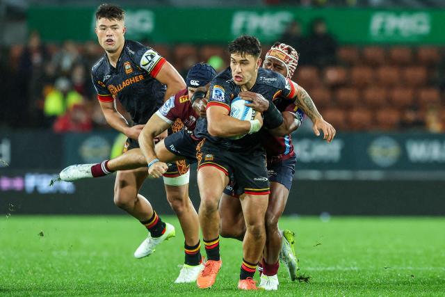 Chiefs' Kyle Brown is tackled during the Super Rugby qualifying final match between the Chiefs and Queensland Reds at FMG Stadium in Hamilton on June 6, 2026. (Photo by DJ MILLS / AFP)