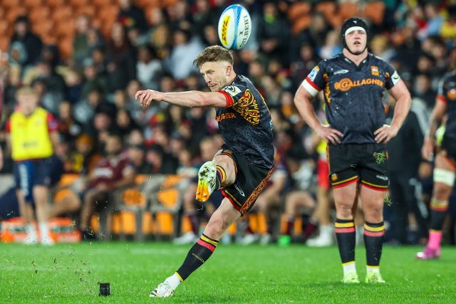 Chiefs' Damian McKenzie kicks the ball during the Super Rugby Qualifying Final match between the Chiefs and Queensland Reds at FMG Stadium in Hamilton on June 6, 2026. (Photo by DJ MILLS / AFP)