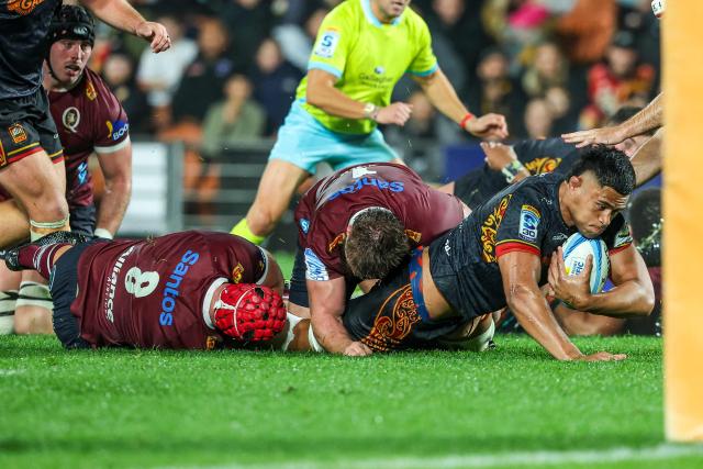 Chiefs' Tupou Vaa’i is tackled during the Super Rugby Qualifying Final match between the Chiefs and Queensland Reds at FMG Stadium in Hamilton on June 6, 2026. (Photo by DJ MILLS / AFP)