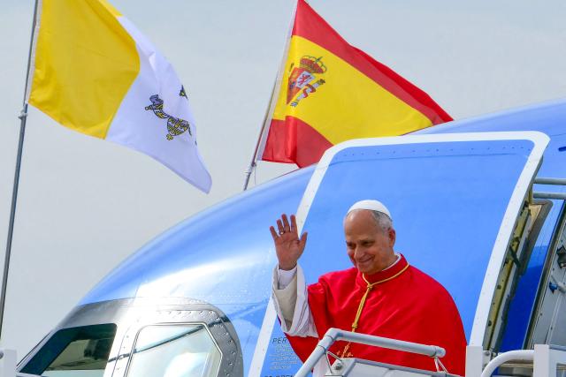 Pope Leo XIV waves upon his arrival at the Adolfo Suarez Madrid/Barajas International Airport, Saturday, June 6, 2026, on the occasion of his Apostolic journey to Spain. Pope Leo XIV is visiting Spain June 6-12 with stops in Madrid, Barcelona, and the Canary Islands, where he will meet with migrants and organisations dedicated to helping them. (Photo by Stefano RELLANDINI / AFP)