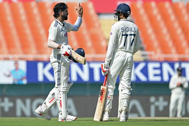 India's KL Rahul (L) celebrates after scoring a century (100 runs) alongside captain Shubman Gill during the first day of the only Test cricket match between India and Afghanistan at the Maharaja Yadavindra Singh International Cricket Stadium on the outskirts of Chandigarh on June 6, 2026. (Photo by Shammi MEHRA / AFP)