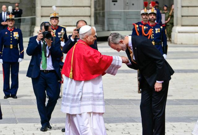 Spain's Felipe VI welcomes Pope Leo XIV at the Royal Palace in Madrid on June 6, 2026. Pope Leo XIV is visiting Spain June 6-12 with stops in Madrid, Barcelona, and the Canary Islands, where he will meet with migrants and organisations dedicated to helping them. (Photo by Stefano RELLANDINI / AFP)