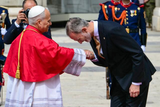Spain's Felipe VI welcomes Pope Leo XIV at the Royal Palace in Madrid on June 6, 2026. Pope Leo XIV is visiting Spain June 6-12 with stops in Madrid, Barcelona, and the Canary Islands, where he will meet with migrants and organisations dedicated to helping them. (Photo by Stefano RELLANDINI / AFP)