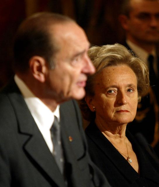 (FILES) France's President Jacques Chirac addresses media as his wife Bernadette Chirac looks on at the presidential Elysee Palace in Paris on December 10, 2001, during a ceremony awarding the insignia of Commander of the Legion of Honor to the Armenian Catholicos Karekin II. Bernadette Chirac, widow of former President of the Republic Jacques Chirac, died on June 5, 2026 in the evening at the age of 93, her daughter Claude Chirac told AFP on June 6, 2026. (Photo by PATRICK KOVARIK / AFP)