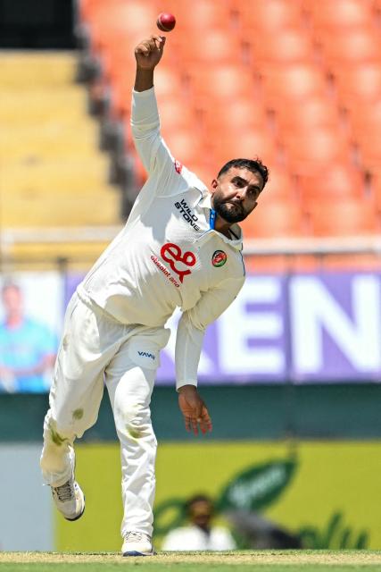 Afghanistan's captain Hashmatullah Shahidi delivers a ball during the first day of the only Test cricket match between India and Afghanistan at the Maharaja Yadavindra Singh International Cricket Stadium on the outskirts of Chandigarh on June 6, 2026. (Photo by Shammi MEHRA / AFP)