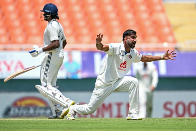 Afghanistan's Mohammad Saleem (R) unsuccessfully appeals for leg before wicket (LBW) against India's KL Rahul during the first day of the only Test cricket match between India and Afghanistan at the Maharaja Yadavindra Singh International Cricket Stadium on the outskirts of Chandigarh on June 6, 2026. (Photo by Shammi MEHRA / AFP)