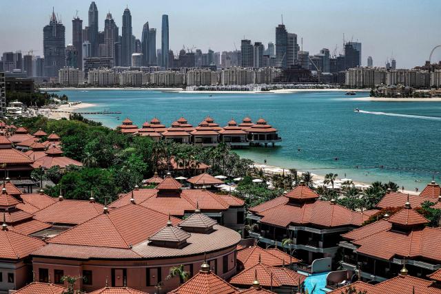 The Anantara The Palm Dubai Resort is pictured near the Dubai Marina (background) in Dubai on June 6, 2026. (Photo by FADEL SENNA / AFP)