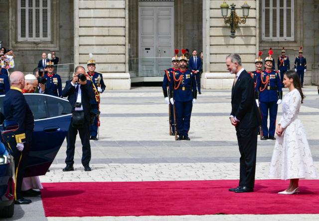 Spain's Felipe VI and Queen Letizia welcome Pope Leo XIV at the Royal Palace in Madrid on June 6, 2026. Pope Leo XIV is visiting Spain June 6-12 with stops in Madrid, Barcelona, and the Canary Islands, where he will meet with migrants and organisations dedicated to helping them. (Photo by Stefano RELLANDINI / AFP)