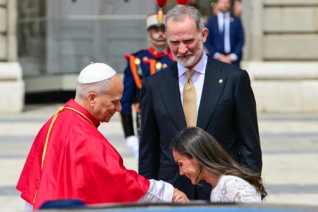 Spain's Felipe VI and Queen Letizia welcome Pope Leo XIV at the Royal Palace in Madrid on June 6, 2026. Pope Leo XIV is visiting Spain June 6-12 with stops in Madrid, Barcelona, and the Canary Islands, where he will meet with migrants and organisations dedicated to helping them. (Photo by Stefano RELLANDINI / AFP)