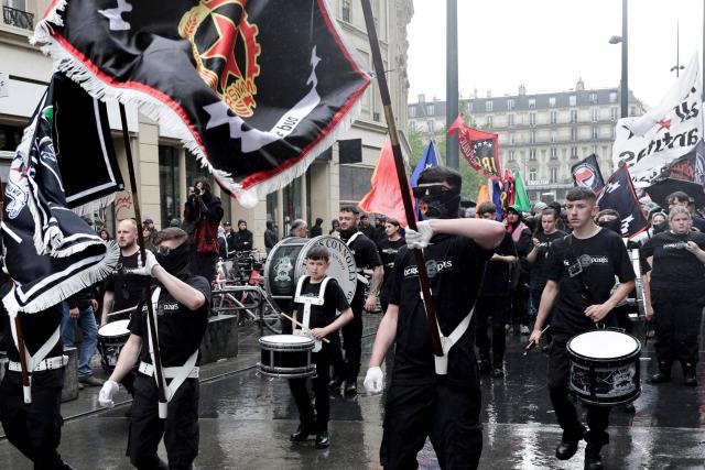 Demonstrators wave a Republican Socialist Youth Movement (RSYM) flag as they take part in a march to mark the 13th anniversary of the murder in 2013 of anti-fascist militant Clément Méric following a brawl with skinheads, in Paris on June 6, 2026. (Photo by STEPHANE DE SAKUTIN / AFP)