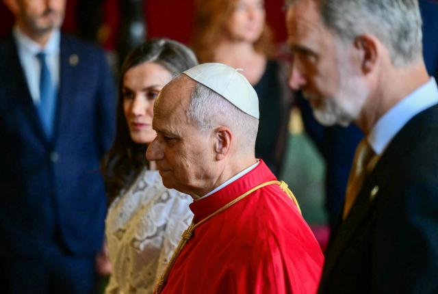 Spain's Felipe VI and Queen Letizia welcome Pope Leo XIV at the Royal Palace in Madrid on June 6, 2026. Pope Leo XIV is visiting Spain June 6-12 with stops in Madrid, Barcelona, and the Canary Islands, where he will meet with migrants and organisations dedicated to helping them. (Photo by Stefano RELLANDINI / AFP)
