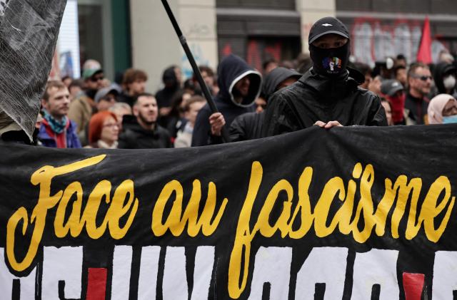 A demonstrator takes part in a march to mark the 13th anniversary of the murder in 2013 of anti-fascist militant Clément Méric following a brawl with skinheads, in Paris on June 6, 2026. (Photo by STEPHANE DE SAKUTIN / AFP)