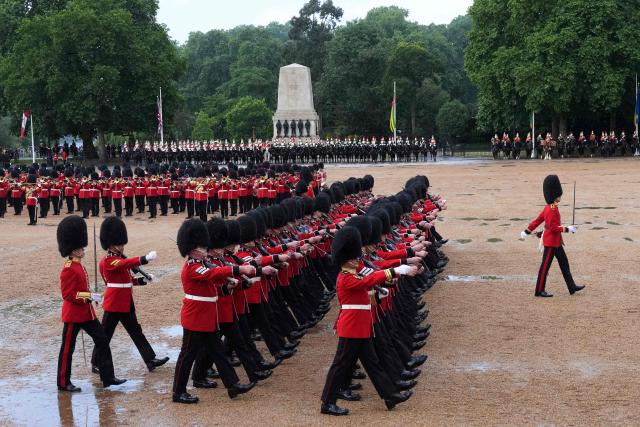 Grenadier Guards, members of the Household Division take part in the Colonel's Review on Horse Guards Parade in London on June 6, 2026. The Colonel's Review is the final evaluation of the King's birthday parade before it is seen during the Trooping of the Colour on June 13. (Photo by CARLOS JASSO / AFP)