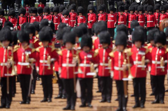 Grenadier Guards, members of the Household Division take part in the Colonel's Review on Horse Guards Parade in London on June 6, 2026. The Colonel's Review is the final evaluation of the King's birthday parade before it is seen during the Trooping of the Colour on June 13. (Photo by CARLOS JASSO / AFP)
