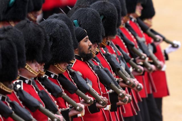 Grenadier Guards, members of the Household Division take part in the Colonel's Review on Horse Guards Parade in London on June 6, 2026. The Colonel's Review is the final evaluation of the King's birthday parade before it is seen during the Trooping of the Colour on June 13. (Photo by CARLOS JASSO / AFP)