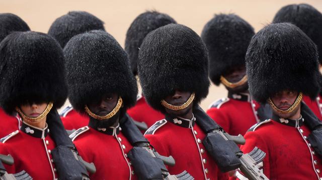 Grenadier Guards, members of the Household Division take part in the Colonel's Review on Horse Guards Parade in London on June 6, 2026. The Colonel's Review is the final evaluation of the King's birthday parade before it is seen during the Trooping of the Colour on June 13. (Photo by CARLOS JASSO / AFP)