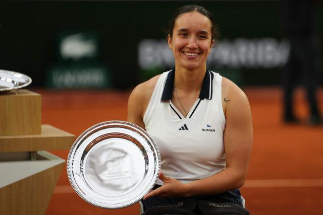 France's Ksenia Chasteau poses with her trophy after being defeating by Netherlands' Diede de Groot in their women's singles wheelchair final match on day 14 of the French Open tennis tournament on Court Suzanne-Lenglen at the Roland-Garros Complex in Paris on June 6, 2026. (Photo by Dimitar DILKOFF / AFP)
