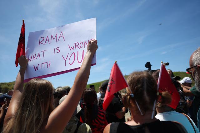 People take part in  a demonstration against the construction of a luxury resort near a protected natural area in Zvernec near Vlore on June 6, 2026. Several thousand citizens demonstrated in Tirana for the second consecutive night on June 4, 2026 to demand transparency around a tourist complex project allegedly linked to US President Donald Trump's son-in-law, Jared Kushner. The demonstrators argue that the estimated $1.2 billion project, led by Kushner and his wife Ivanka, will harm the environment, with plans for luxury hotels in the protected area of Vjosa-Narta on the southern coast. (Photo by Adnan Beci / AFP)