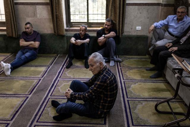 Mourners offer prayers near the body of seven-month-old Sam Fahd Abou Haikal (not pictured), at the Abou Heisheh Mosque in Hebron, in the occupied West Bank on June 6, 2026. The Palestinian health ministry said Israeli gunfire killed an infant and wounded his parents on June 5 in the occupied West Bank. Sam Fahd Abou Haikal died and his parents were lightly injured "after the occupation forces opened fire on them on June 5 evening" in the south of the city of Hebron, the ministry said. (Photo by JOHN WESSELS / AFP)