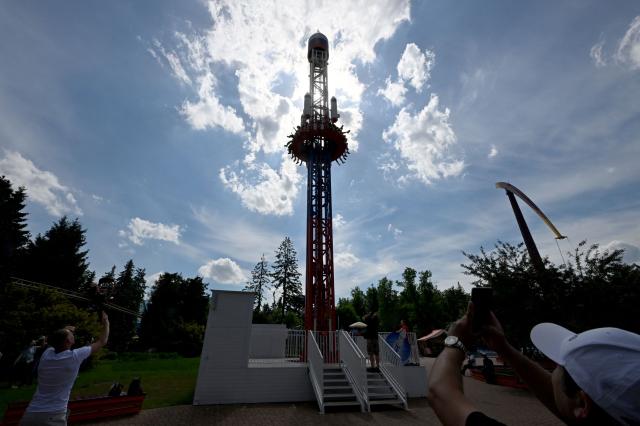 Visitors ride the "Oreshnik" attraction, named after Russia's nuclear-capable intermediate-range ballistic missile, at Divo Island amusement park in Saint Petersburg on June 6, 2026. (Photo by Olga MALTSEVA / AFP)