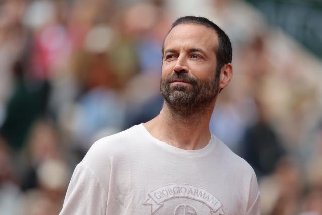 French dancer and choreographer Benjamin Millepied looks ahead on Court Philippe-Chatrier prior to the women's final singles match on day 14 of the French Open tennis tournament at the Roland-Garros Complex in Paris on June 6, 2026. (Photo by Thomas SAMSON / AFP)