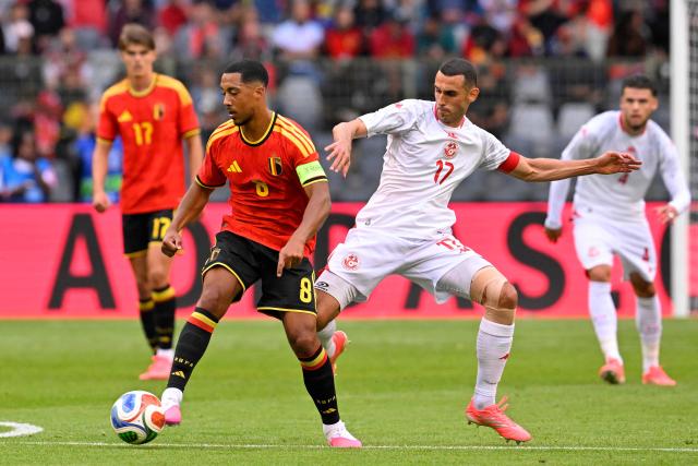 Belgium's midfielder #8 Youri Tielemans (L) fights for the ball with Tunisia's midfielder #17 Ellyes Skhiri (R) during the international friendly football match between Belgium and Tunisia at the King Baudouin Stadium in Brussels on June 6, 2026. (Photo by JOHN THYS / AFP)